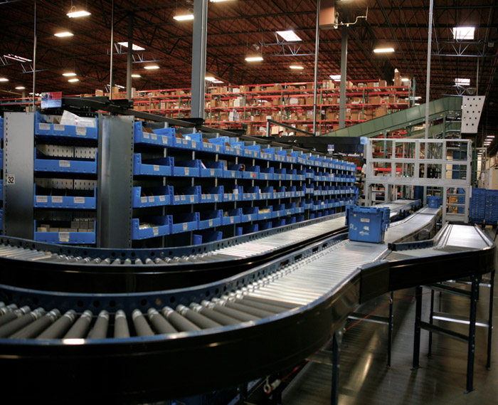 White Intelligent Storage Horizontal Carousel System with rotating bins and conveyor integration