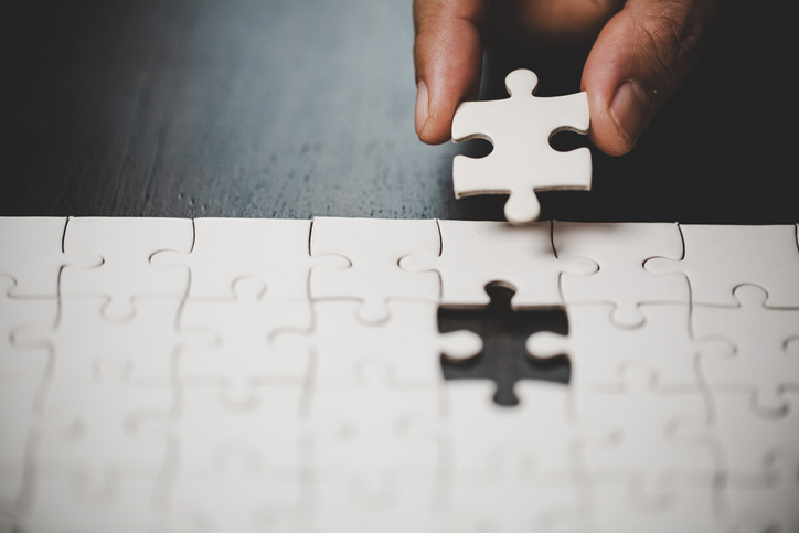 hand with puzzle piece